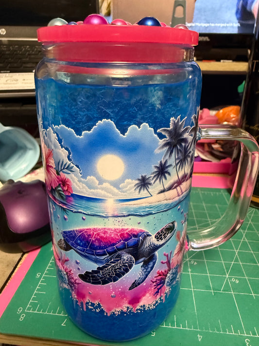 Turtle Island with blue slush and bling lid 16 oz glass snow globe with handle